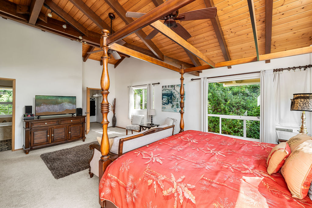 1444 East Kuiaha Road Haiku, HI 96708 - Photo 5 of 30 a bed sitting in a spacious bedroom next to a window