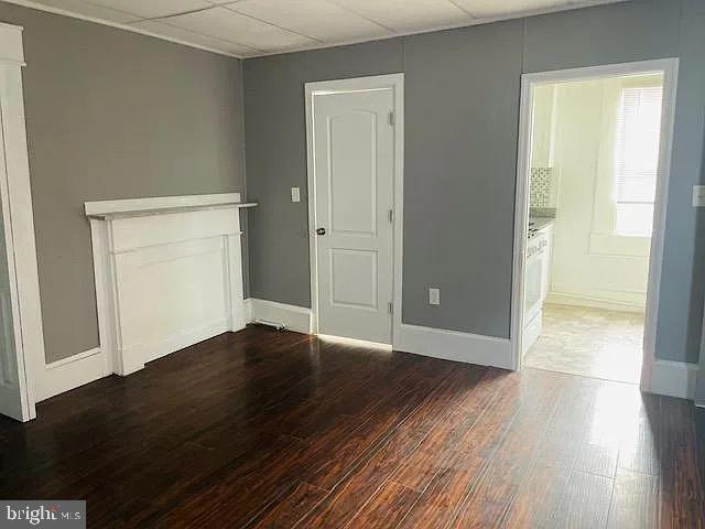 1112 North Eden Street Baltimore, MD 21213 - Photo 11 of 16 an empty room with wooden floor and closet