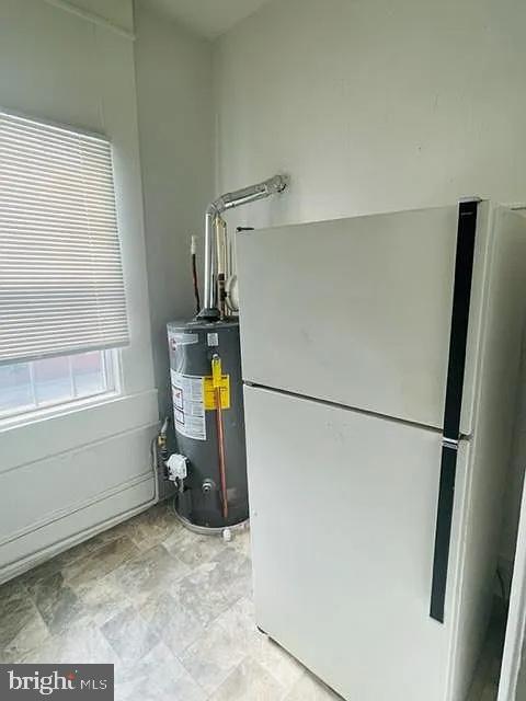 1112 North Eden Street Baltimore, MD 21213 - Photo 2 of 16 a utility room with dryer and washer