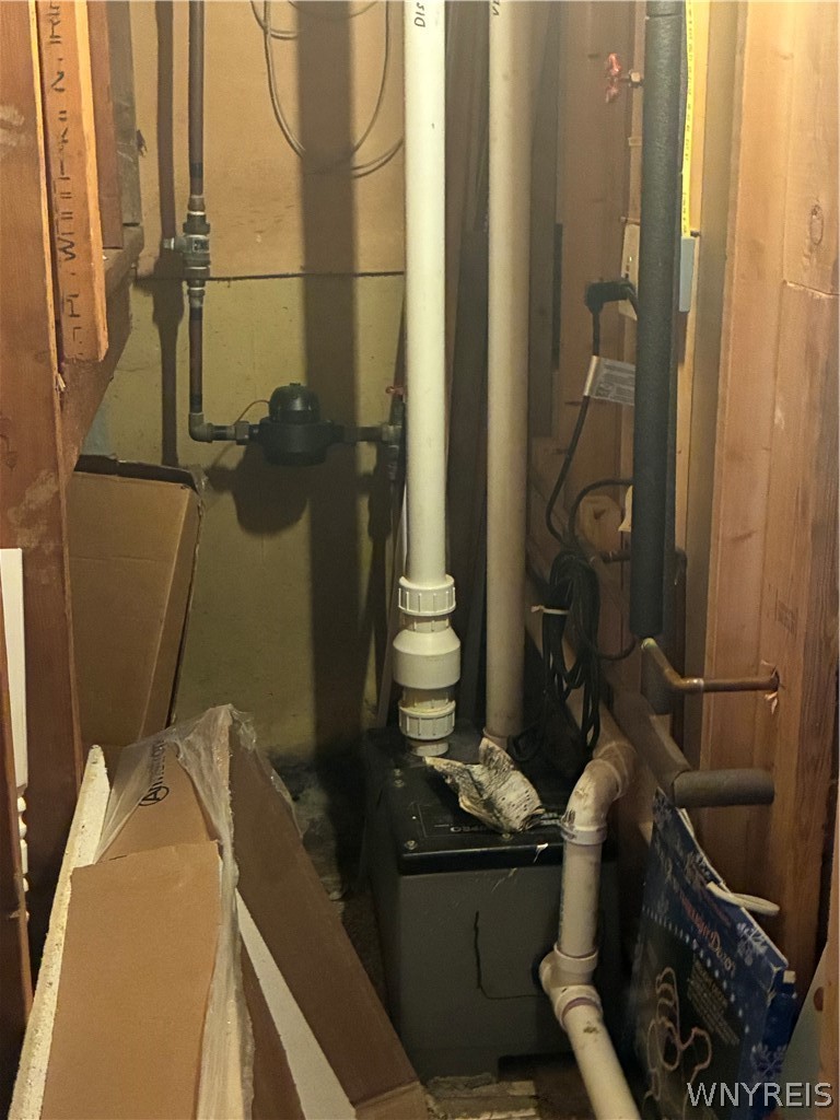 3979 Ridge Lea Drive Newfane, NY 14094 - Photo 40 of 50 WATER METER/BATHROOM PUMP UNDER STAIRS