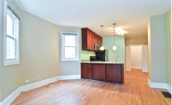 a view of a kitchen counter space and windows