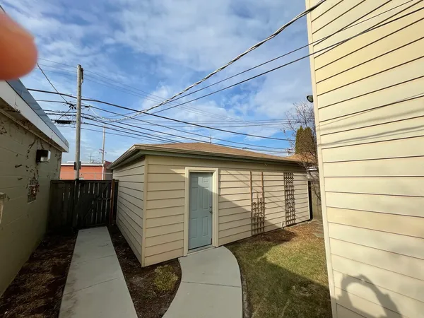 a yellow house with a outdoor space