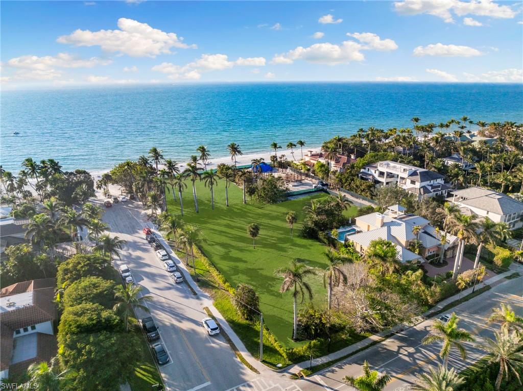 45 5th Avenue South Naples, FL 34102 - Photo 2 of 4 Aerial overview of property's location featuring expansive coastline and nearby suburban area