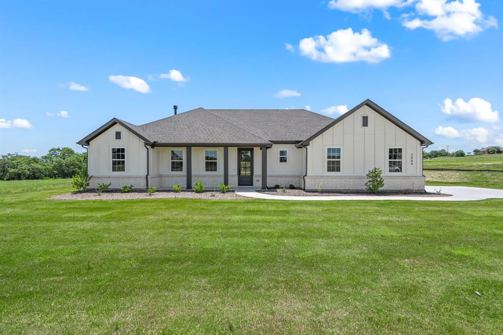 2004 Willy Dilly Road Springtown, TX 76082 - Photo 1 of 1 a view of a house with a backyard