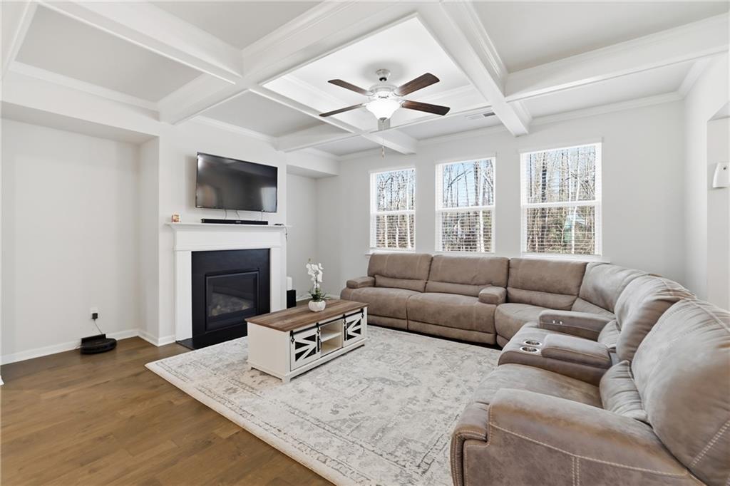 175 Paxton Lane Jefferson, GA 30549 - Photo 5 of 39 a living room with furniture a fireplace and a flat screen tv