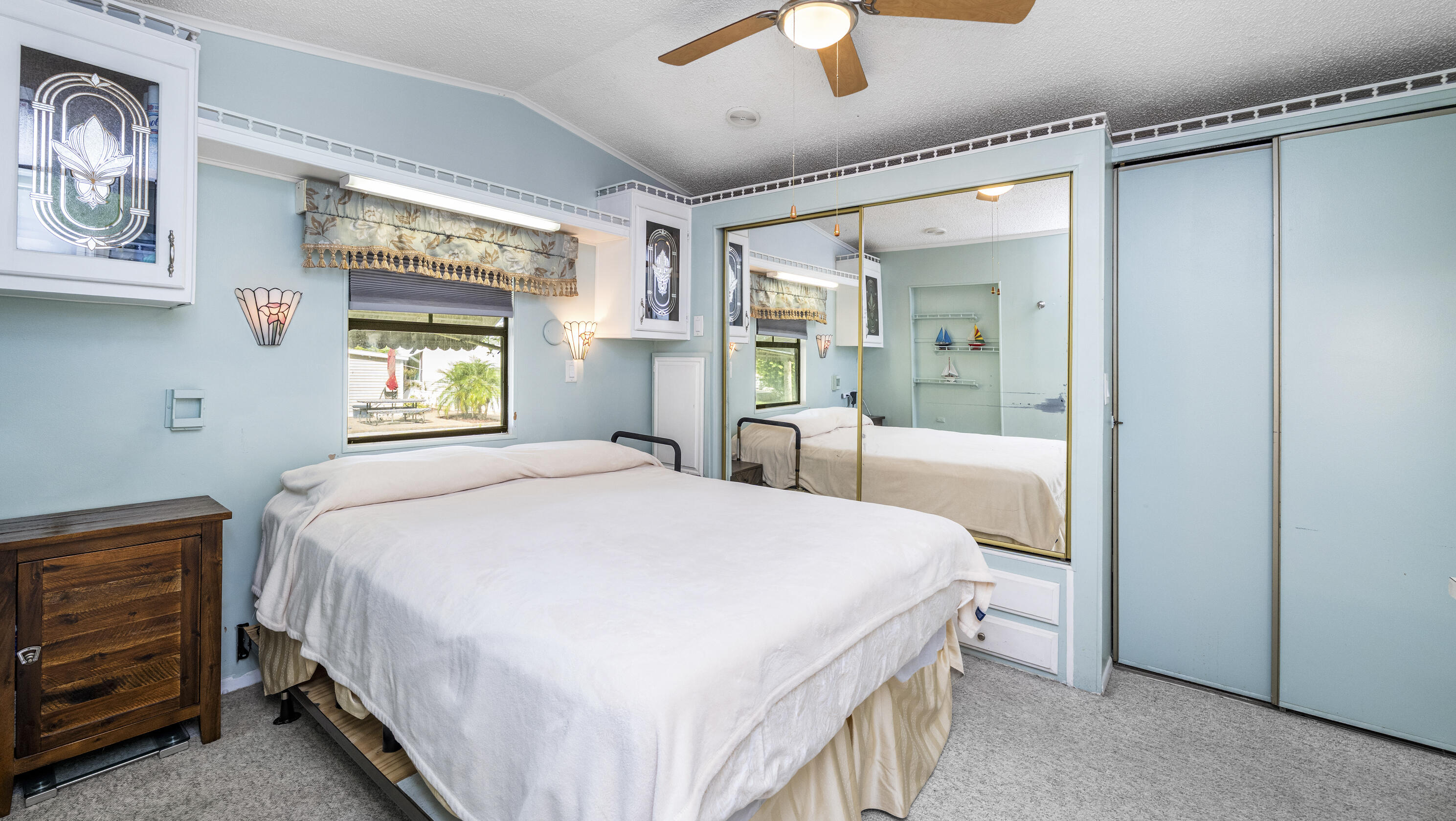 186 Panther Pass Circle Naples, FL 34114 - Photo 19 of 40 a bedroom with a large bed and a window