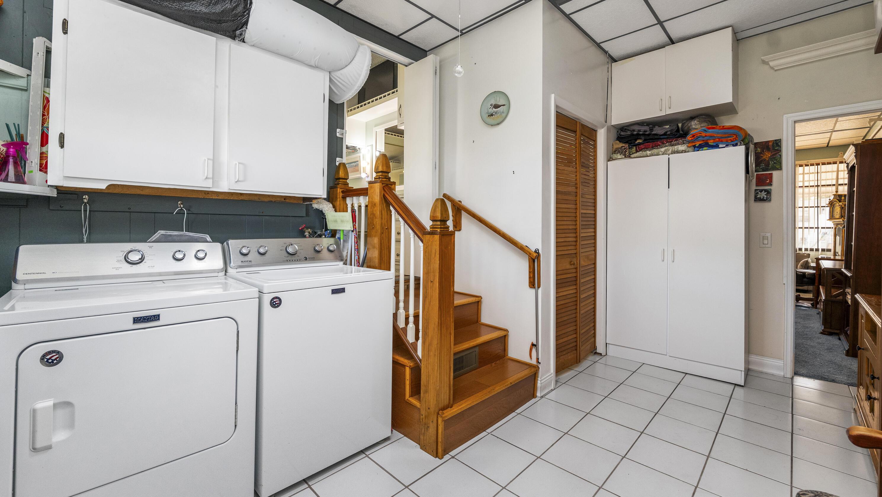 186 Panther Pass Circle Naples, FL 34114 - Photo 21 of 40 a utility room with dryer and washer