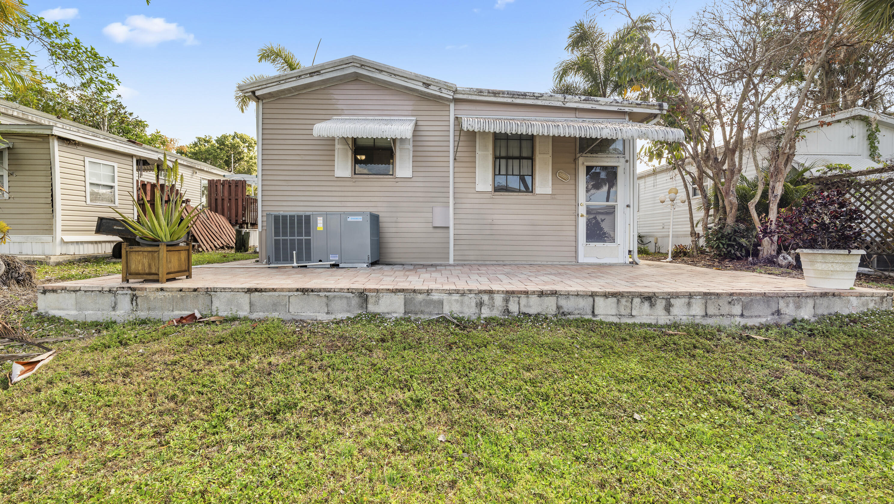186 Panther Pass Circle Naples, FL 34114 - Photo 22 of 40 a front view of a house with a yard