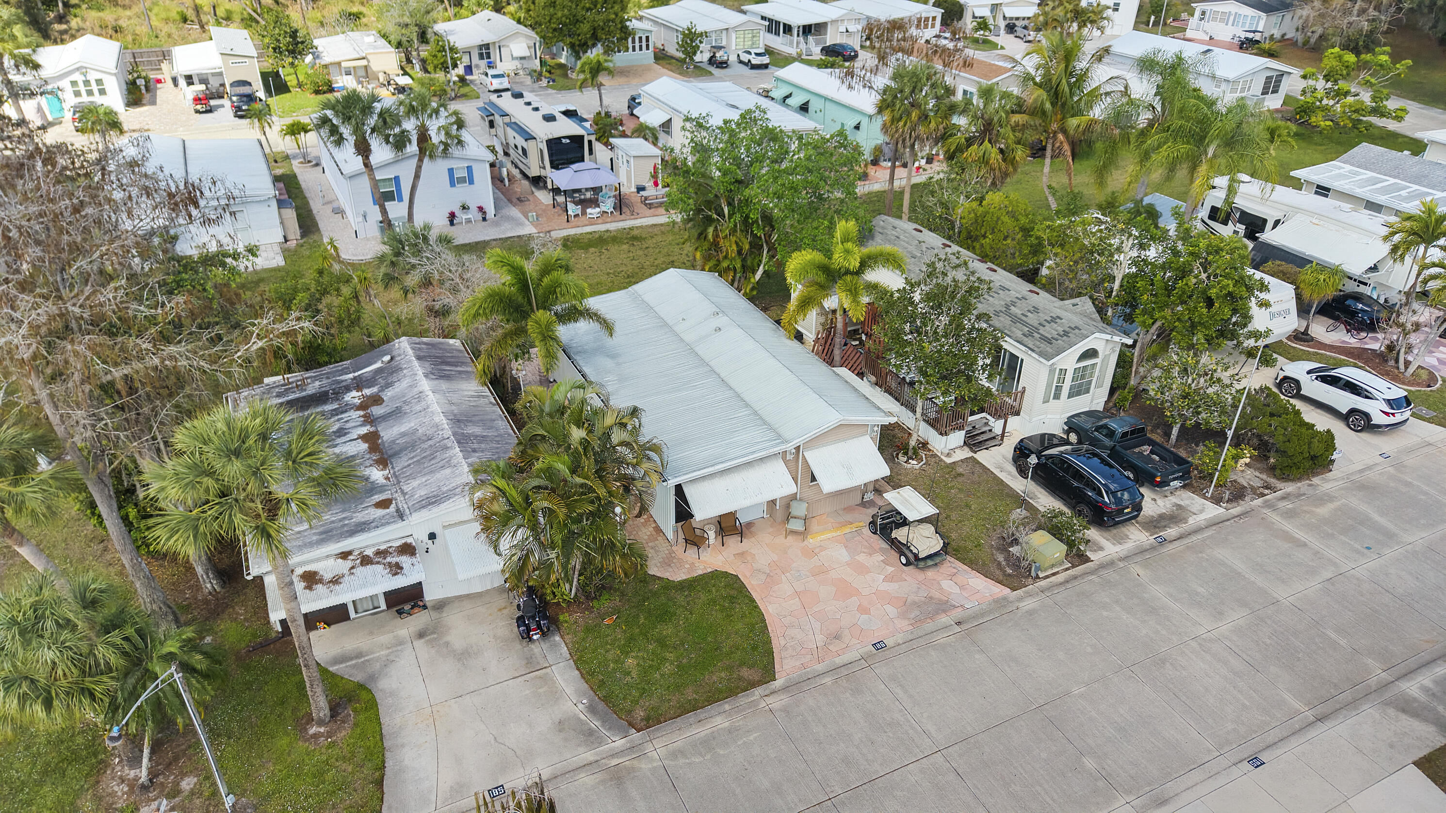 186 Panther Pass Circle Naples, FL 34114 - Photo 23 of 40 an aerial view of a house with a yard and garden