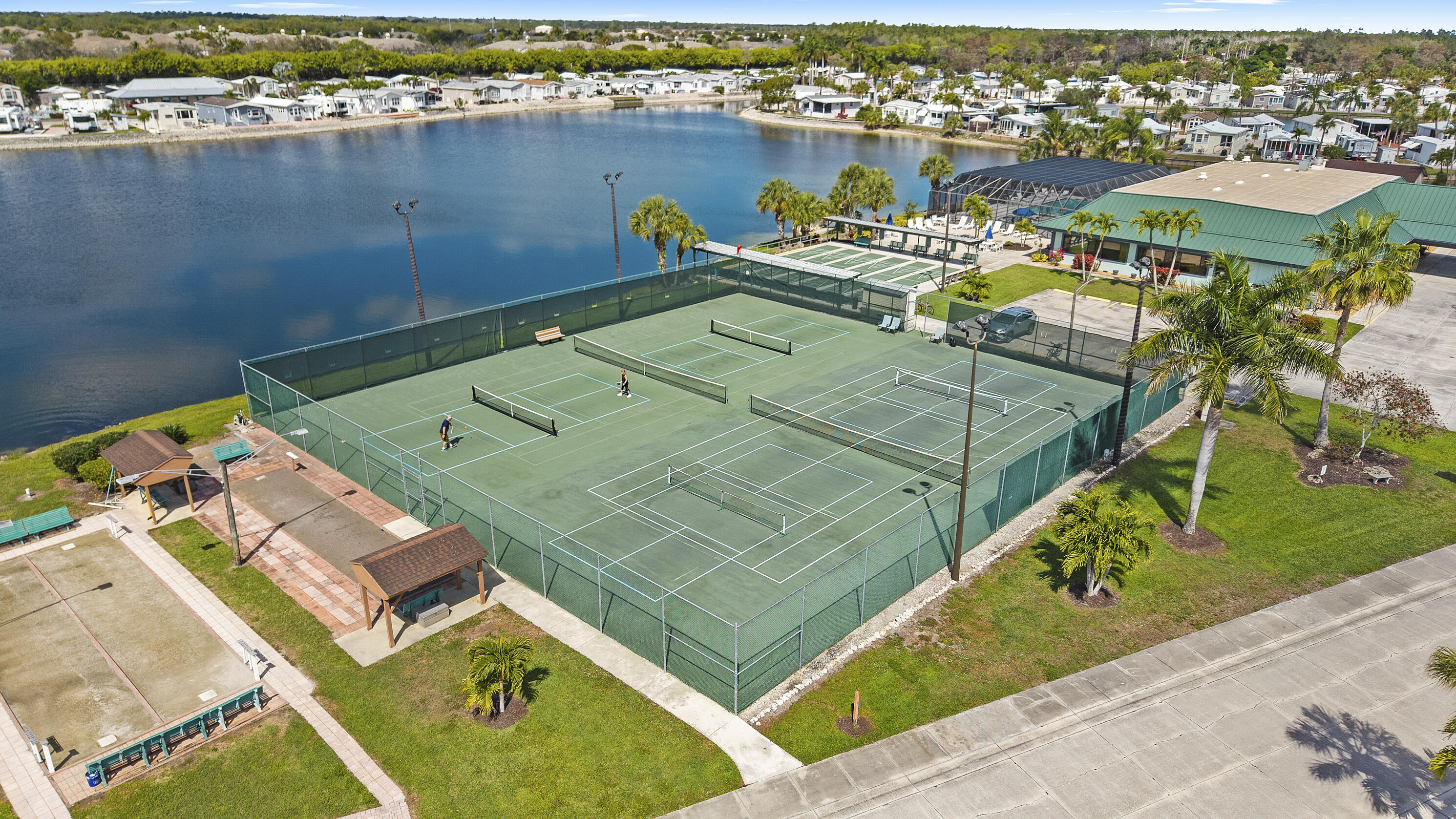186 Panther Pass Circle Naples, FL 34114 - Photo 24 of 40 an aerial view of a house with a lake view