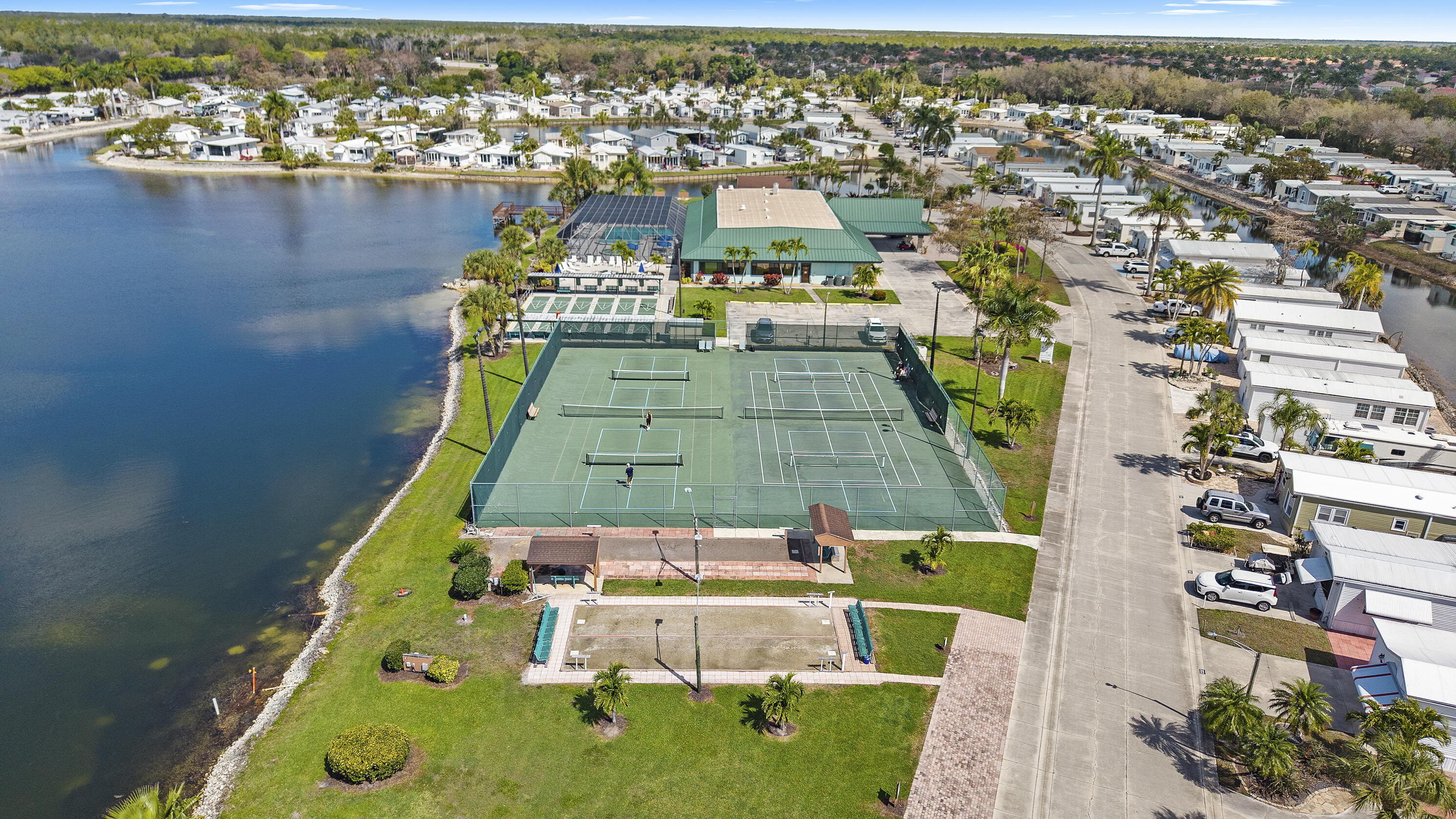 186 Panther Pass Circle Naples, FL 34114 - Photo 25 of 40 an aerial view of a house with a swimming pool