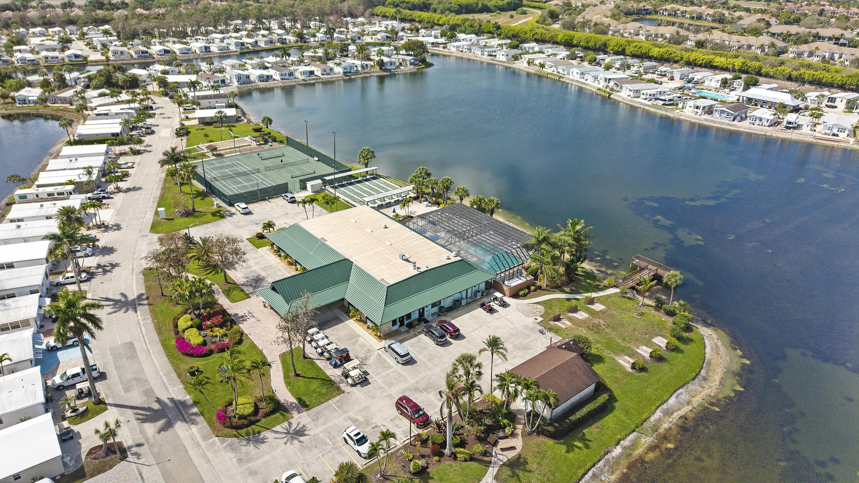 186 Panther Pass Circle Naples, FL 34114 - Photo 30 of 40 an aerial view of a house with a lake view
