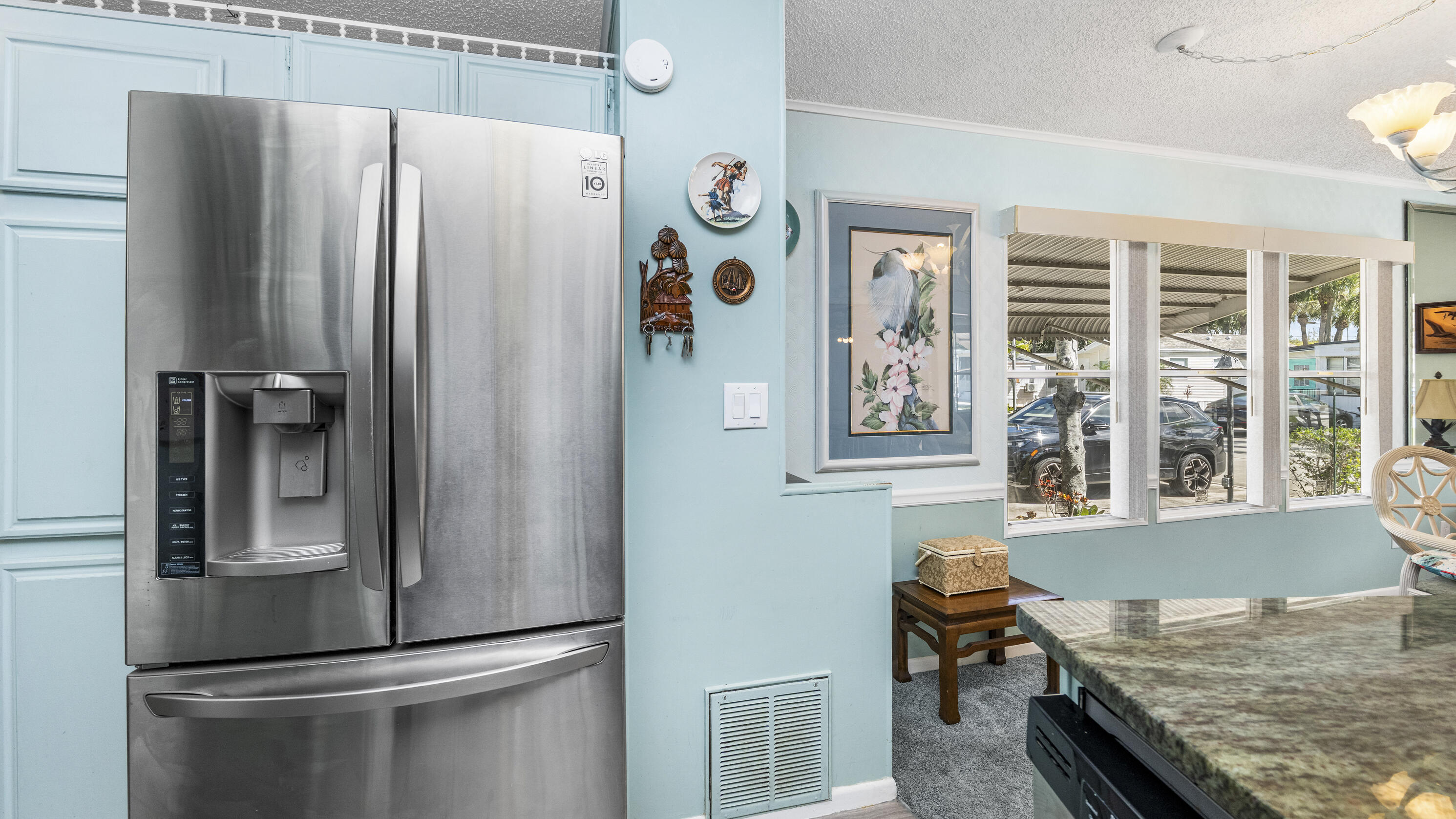 186 Panther Pass Circle Naples, FL 34114 - Photo 3 of 40 a kitchen with stainless steel appliances granite countertop a refrigerator and a sink