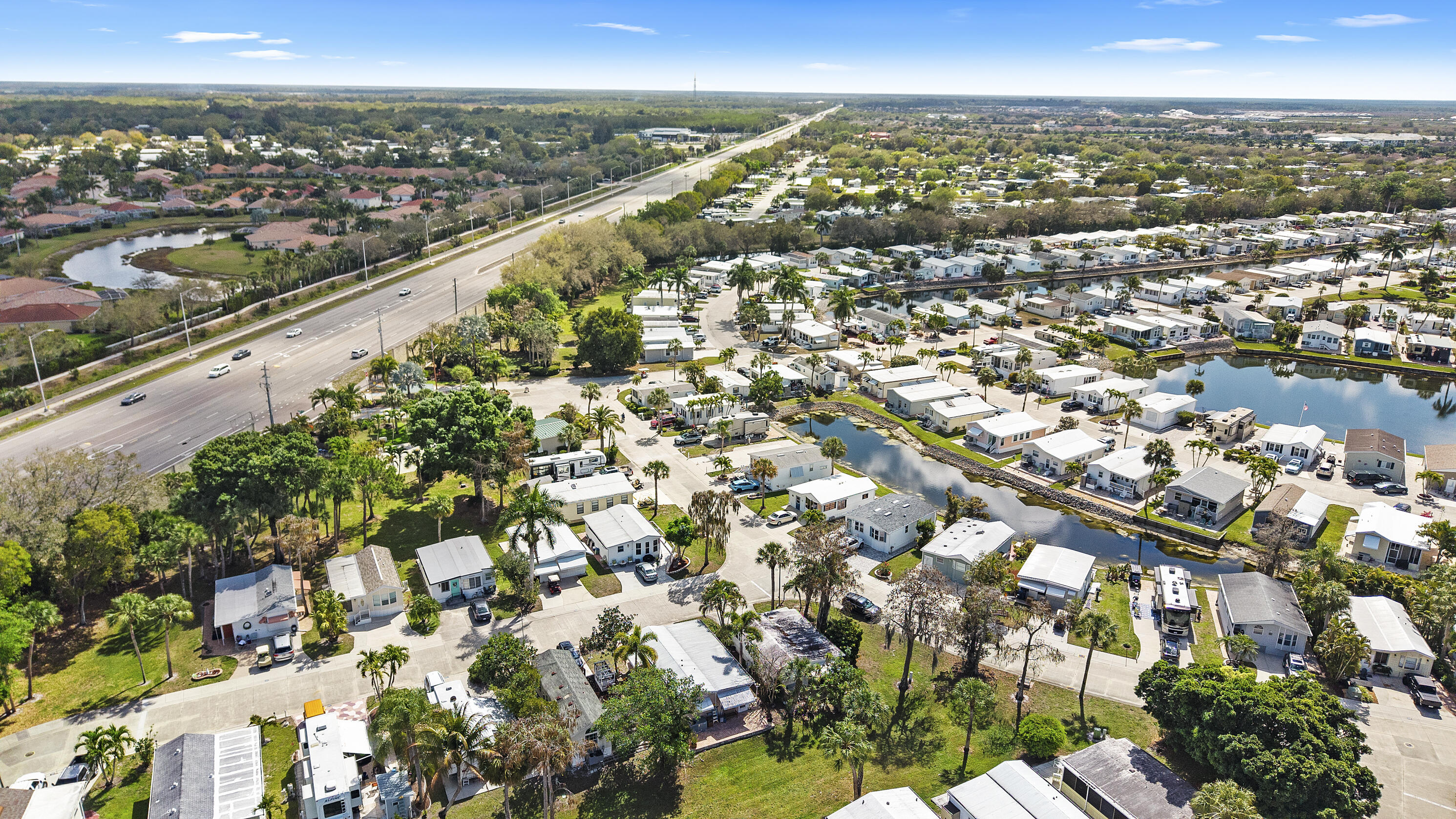 186 Panther Pass Circle Naples, FL 34114 - Photo 34 of 40 an aerial view of city and lake