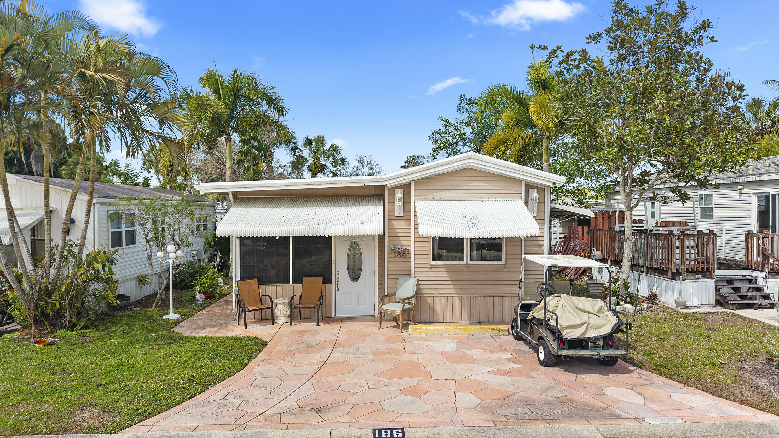 186 Panther Pass Circle Naples, FL 34114 - Photo 40 of 40 a view of a house with backyard sitting area and garden