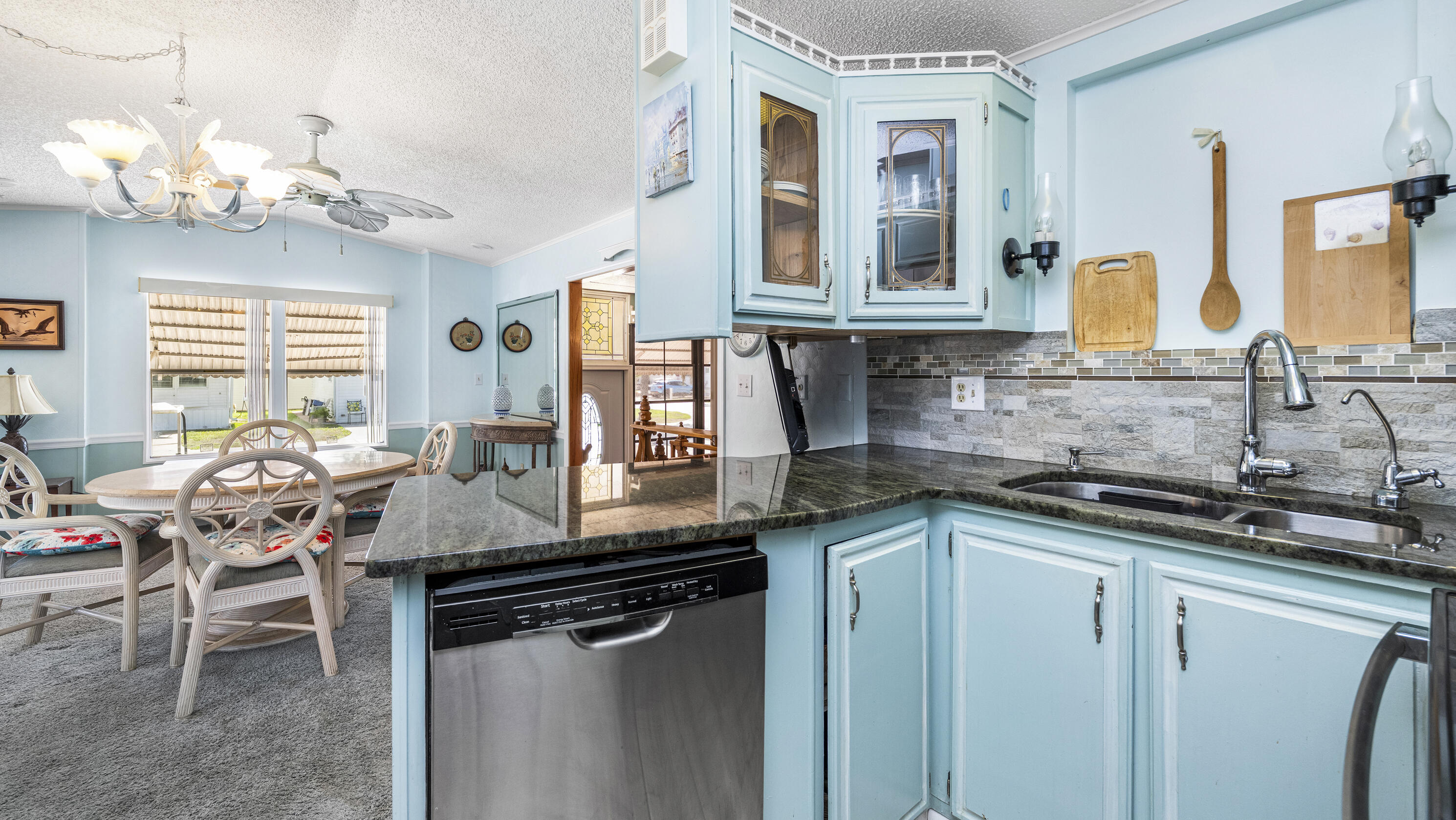 186 Panther Pass Circle Naples, FL 34114 - Photo 4 of 40 a kitchen with a sink cabinets and window