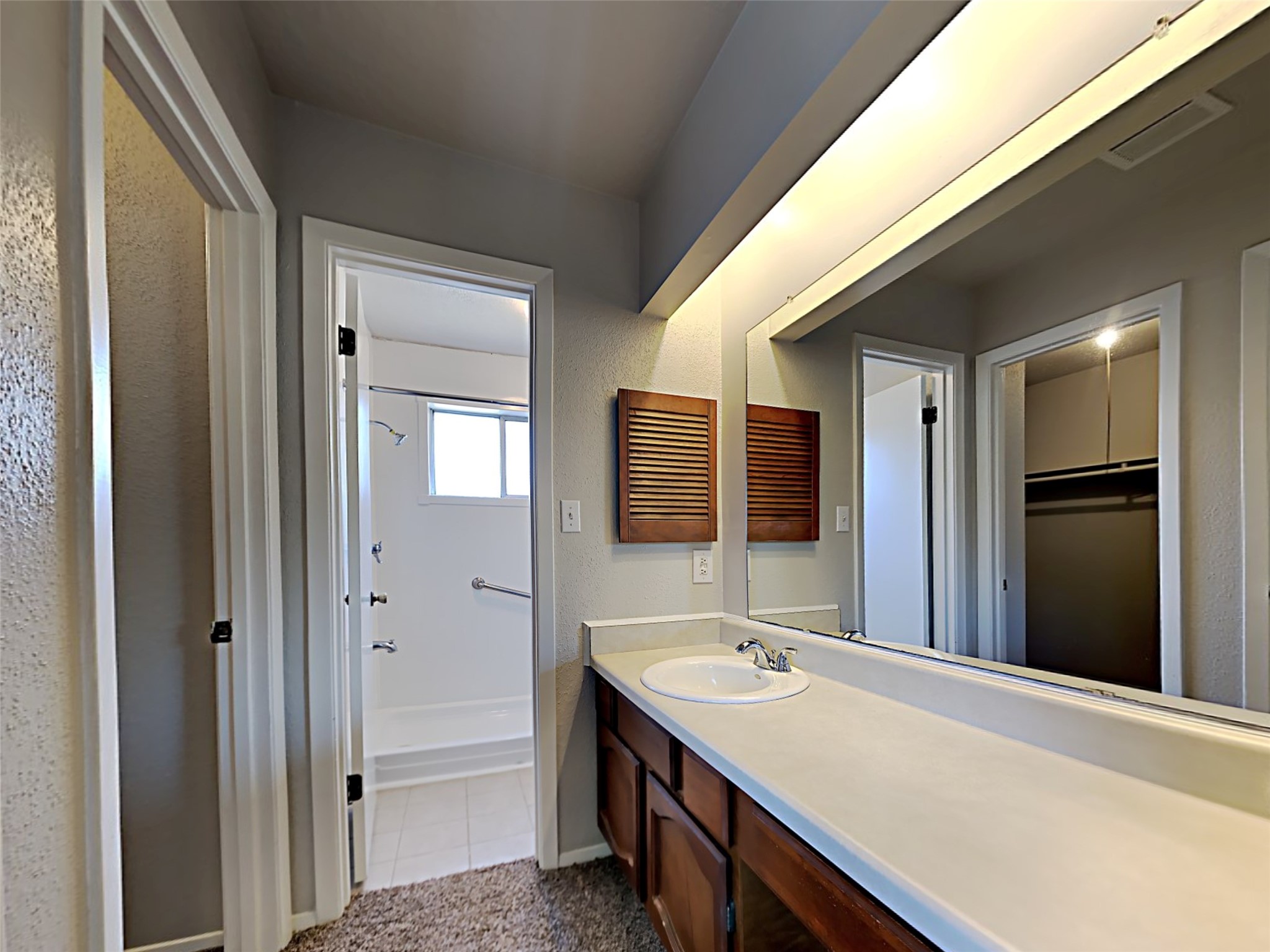 14919 Wainsfield Lane Channelview, TX 77530 - Photo 16 of 17 a bathroom with a sink double vanity and a mirror
