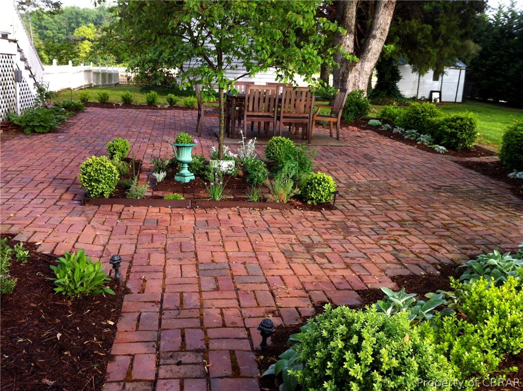 11545 Mary Ball Road Lancaster, VA 22503 - Photo 33 of 46 PATIO ENTERTAINMENT AWAITS ON THIS OVERSIZED BRICK PATIO SURROUNDED BY BOXWOODS