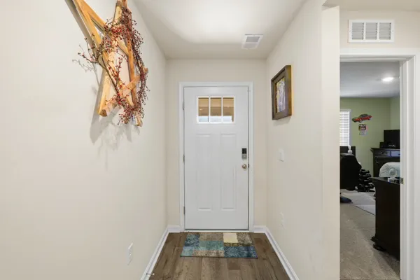 a view of hallway with livingroom