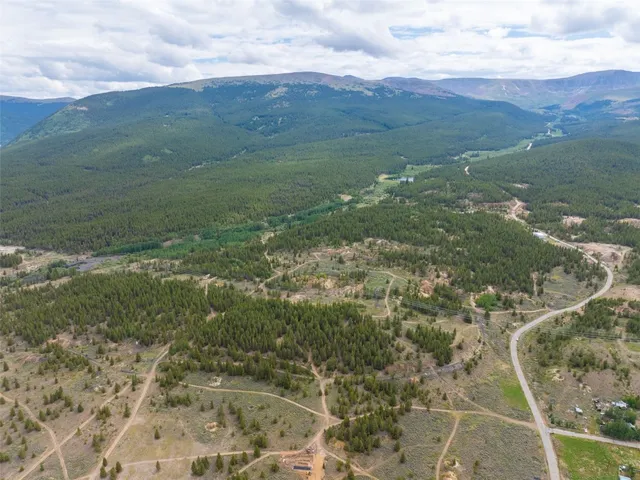 a view of a field with an ocean