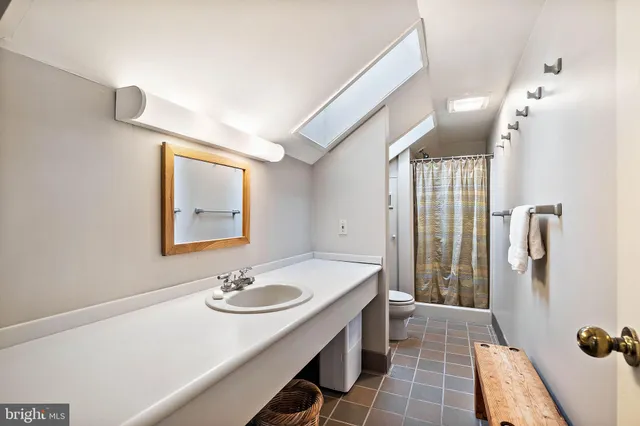 a room with a sink and cabinets