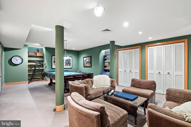 a kitchen with stainless steel appliances granite countertop a stove refrigerator and microwave