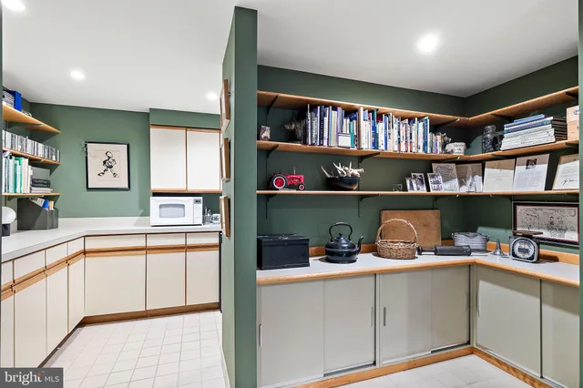 a kitchen with stainless steel appliances a sink stove and cabinets