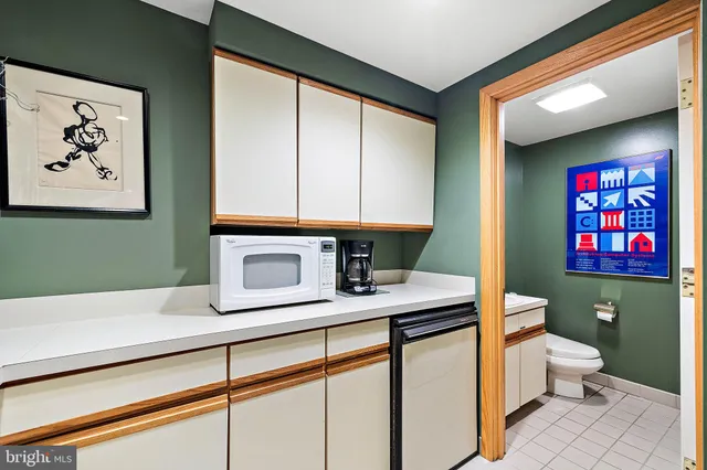 a room with a large window and a glass door shower