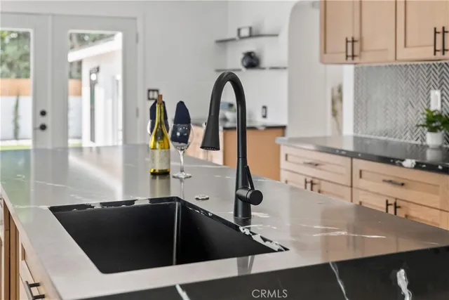 a view of a kitchen with electric appliances