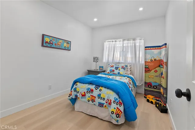 a bathroom with a sink and mirror with toilet
