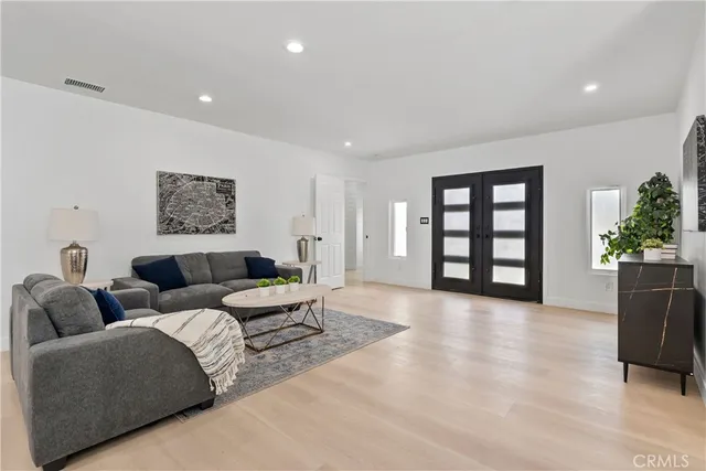 a living room with furniture and natural light