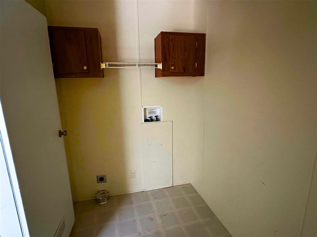 1395 Blackjack Road Valley View, TX 76272 - Photo 13 of 22 a bathroom with a sink and a mirror