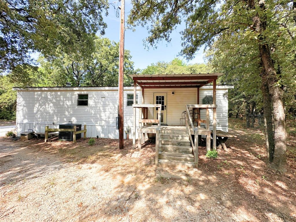 1395 Blackjack Road Valley View, TX 76272 - Photo 14 of 22 a view of a outdoor space with a patio and fire pit
