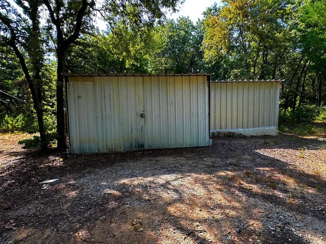 a view of backyard with green space