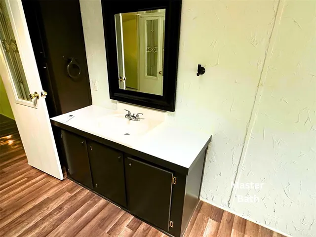 a bathroom with a sink and a mirror