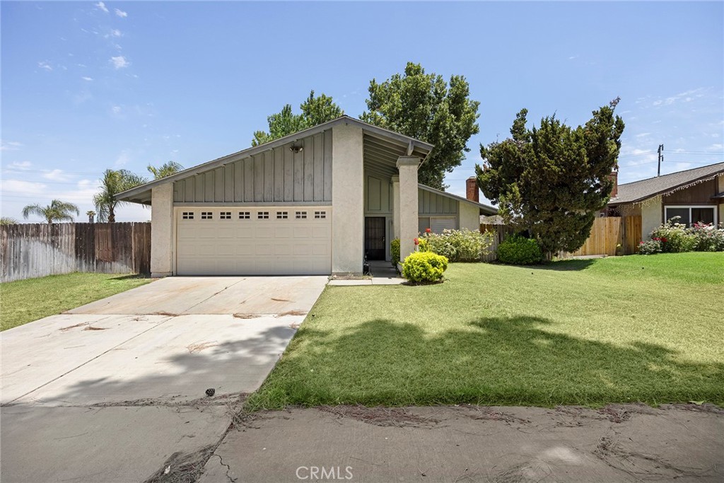2949 Constellation Place Riverside, CA 92503 - Photo 1 of 1 a front view of a house with a yard and garage