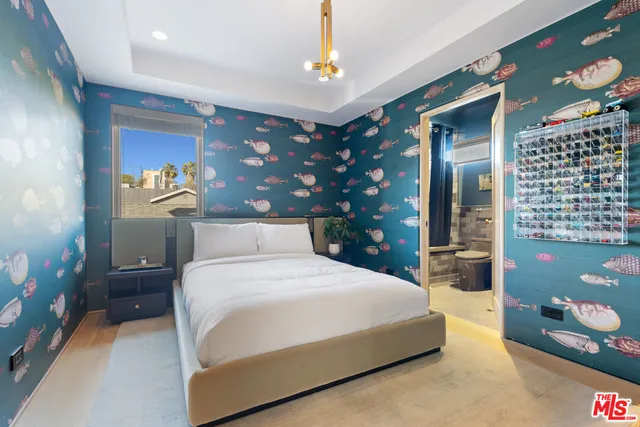 a bedroom with a bed and a lamp with window