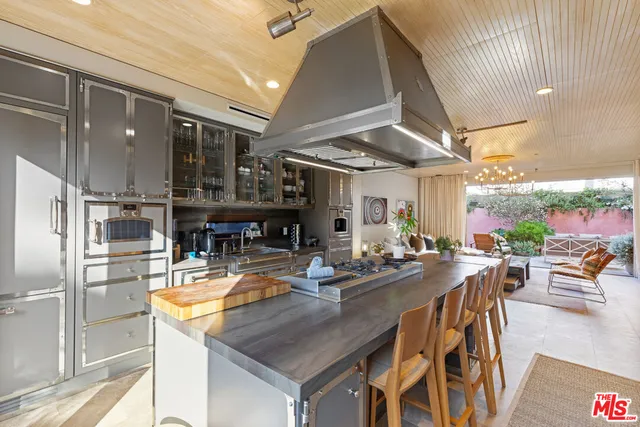 a kitchen with a table and chairs