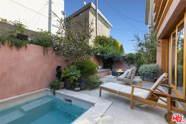a house view with a sitting space and garden