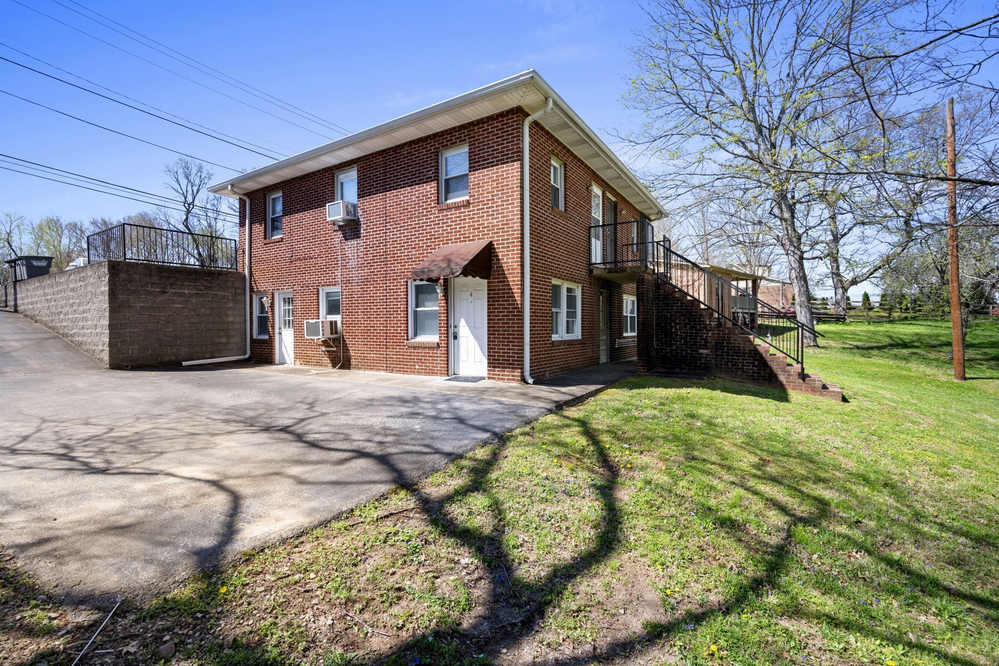 521 Hawkins Road, Unit 2 Clarksville, TN 37040 - Photo 14 of 16 a front view of a house with a yard and garage