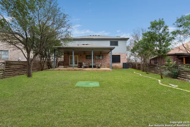 a view of a house with a yard porch and sitting area