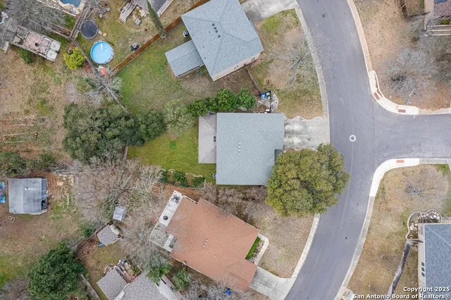 an aerial view of a house with outdoor space