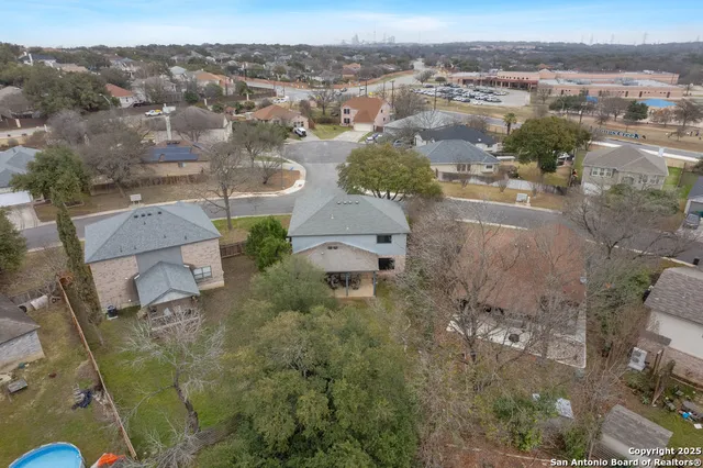 an aerial view of residential houses with outdoor space