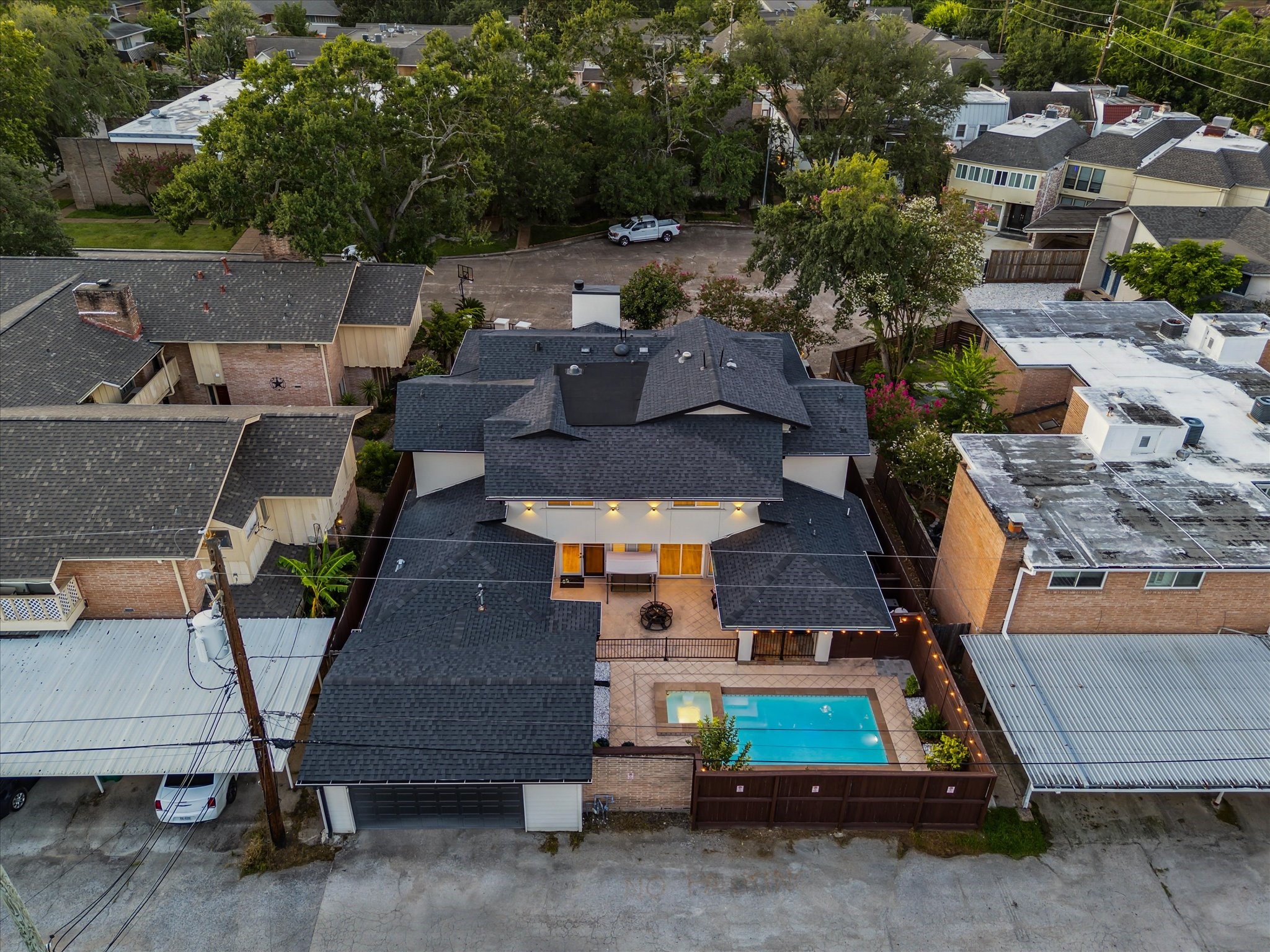 6321 Deerwood Road Houston, TX 77057 - Photo 2 of 34 Rear aerial highlighting the private pool, patio and detached garage.