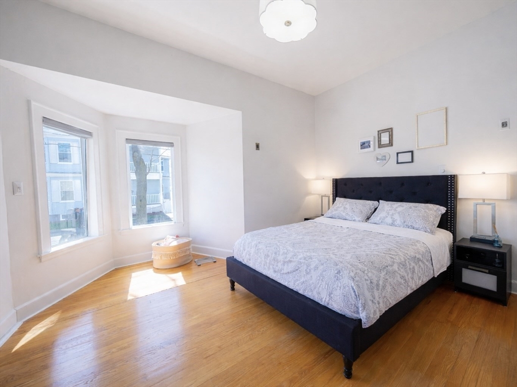 10 Guild Road Saugus, MA 01906 - Photo 17 of 32 a bedroom with a bed and window