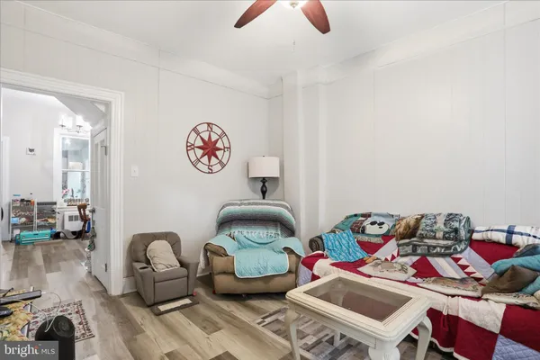 a room with furniture a rug and a chandelier
