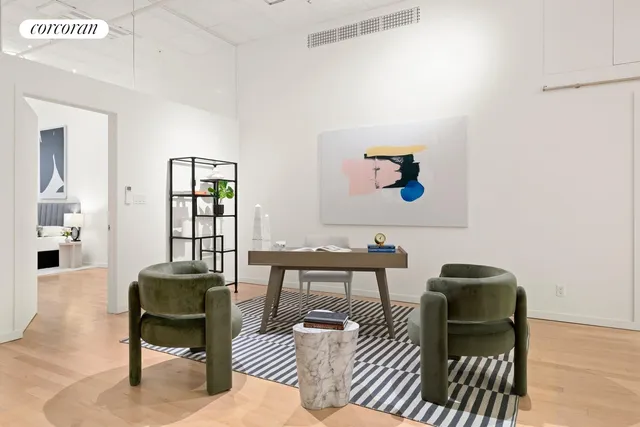 a workspace with furniture and window