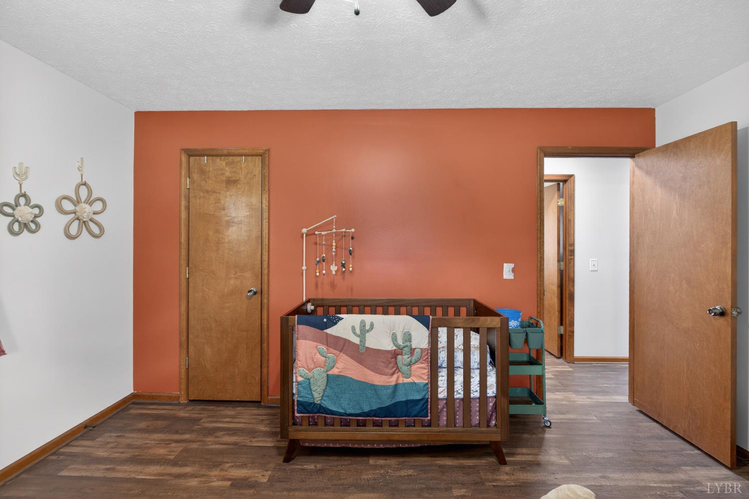 1002 Homeplace Road Rustburg, VA 24588 - Photo 23 of 48 a bedroom with a bed and wooden floor