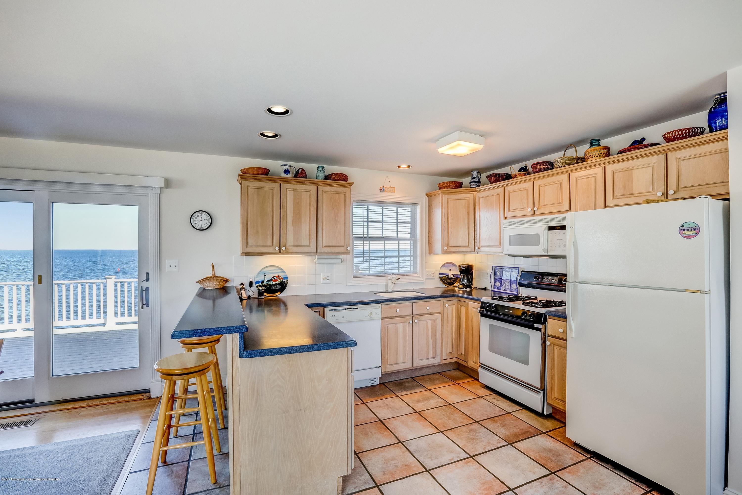 107 Clifton Road Barnegat, NJ 08005 - Photo 6 of 33 a kitchen with granite countertop a refrigerator stove top oven and sink