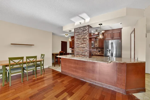 a living room with furniture fireplace and flat screen tv